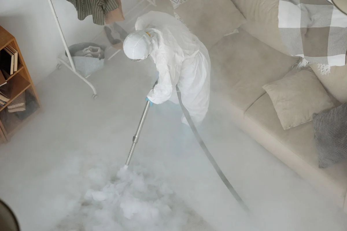 Biohazard cleanup technician in protective equipment, Evergreen, CO